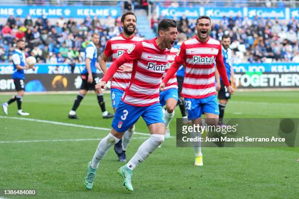 Sergio Escudero of Granada CF celebrates with teammates after scoring their team's first goal during the LaLiga Santander match between Deportivo...