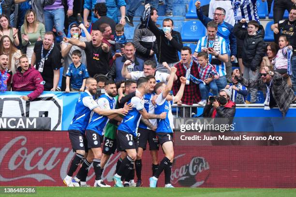 Manu Vallejo of Deportivo Alaves celebrates with teammates after scoring their team's second goal during the LaLiga Santander match between Deportivo...