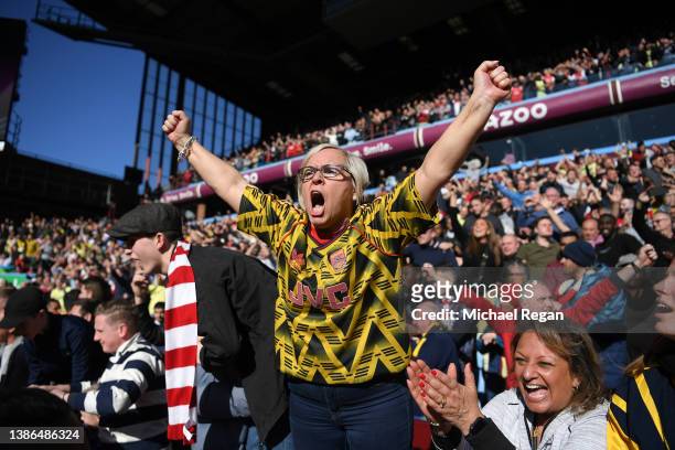 Arsenal fans show their support during the Premier League match between Aston Villa and Arsenal at Villa Park on March 19, 2022 in Birmingham,...