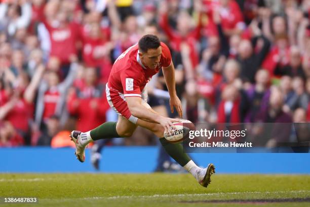 Owen Watkin of Wales on his way to scoring their sides first try during the Six Nations Rugby match between Wales and Italy at Principality Stadium...