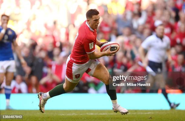 Owen Watkin of Wales on his way to scoring their sides first try during the Six Nations Rugby match between Wales and Italy at Principality Stadium...