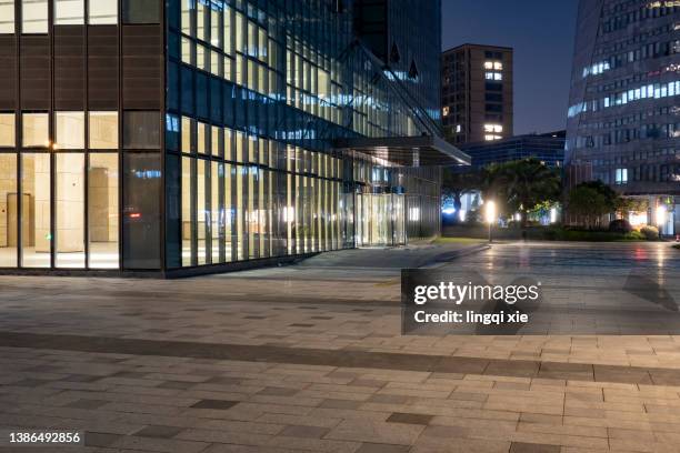 night scene lighting effect of facade of modern building in business district - brick pathway stock pictures, royalty-free photos & images