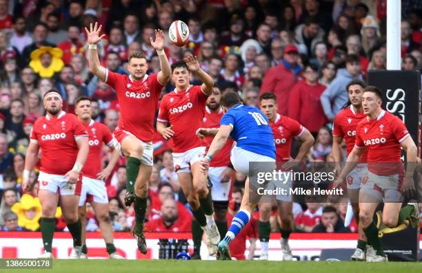 Paolo Garbisi of Italy kicks a conversion to win the game as Dan Biggar and Louis Rees-Zammit attempt a charge down during the Six Nations Rugby...