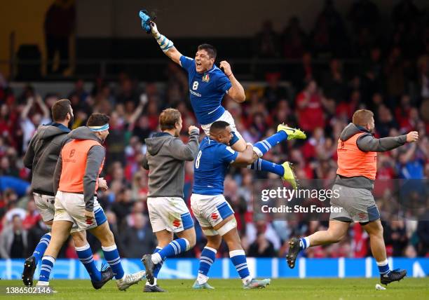 Juan Ignacio Brex of Italy celebrates their sides victory with team mates after the Six Nations Rugby match between Wales and Italy at Principality...