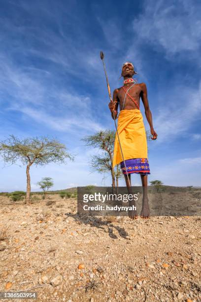 warrior from samburu tribe performing traditional jumping dance, kenya, africa - samburu national park stock pictures, royalty-free photos & images