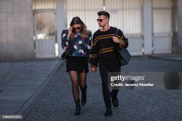 Aline Kaplan is seen wearing Celine shades, Polene Paris black bag, Isabel Marant Etoile shoulder padded colorful jacket, Massimo Dutti black cowboy...