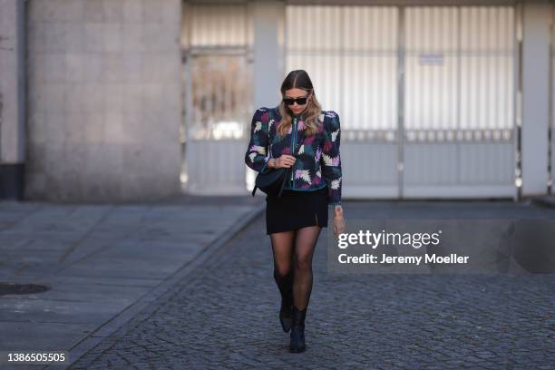 Aline Kaplan is seen wearing Celine shades, Polene Paris black bag, Isabel Marant Etoile shoulder padded colorful jacket, Massimo Dutti black cowboy...