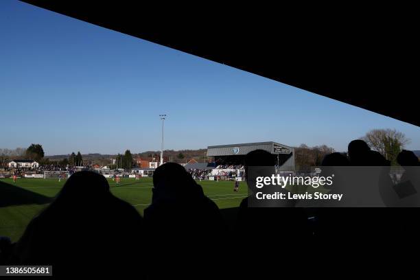 General view inside the stadium as the match is played whilst fans watch on during the North West Counties Football League match between Macclesfield...