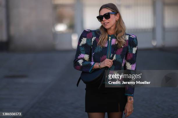 Aline Kaplan is seen wearing Celine shades, Polene Paris black bag, Isabel Marant Etoile shoulder padded colorful jacket, Massimo Dutti black cowboy...