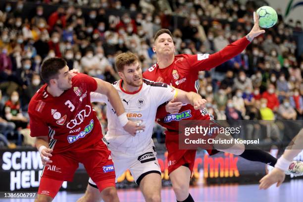 Fabian Wiede of Germany defends against Csaba Leimeter of Hungary during the international handball friendly match between Germany and Hungary at...