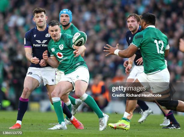 Jonathan Sexton of Ireland releases the ball to Bundee Aki during the Six Nations Rugby match between Ireland and Scotland at Aviva Stadium on March...