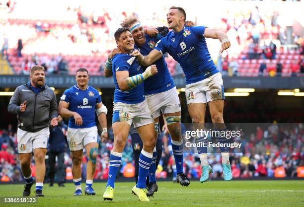 Juan Ignacio Brex, Niccolo Cannone and Edoardo Padovani of Italy celebrate victory over Wales after the Six Nations Rugby match between Wales and...