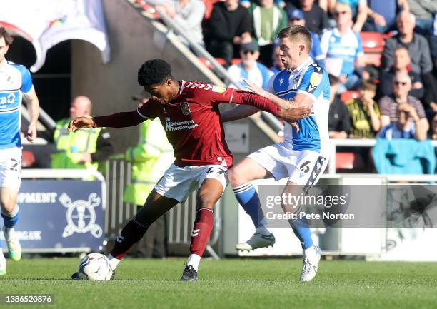 Peter Abimbola of Northampton Town attempts to control the ball under pressure from Sam Finley of Bristol Rovers during the Sky Bet League Two match...