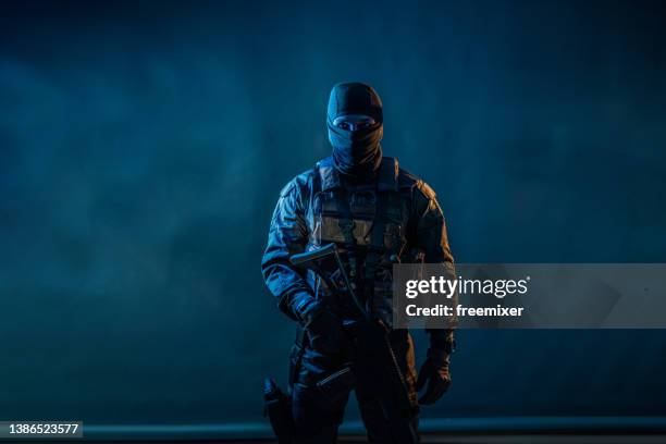 soldier with a rifle - special forces stock pictures, royalty-free photos & images