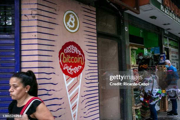 Sign of bitcoin virtual currency drawn on the wall of a closed ice-cream shop on March 17 in Buenos Aires, Argentina. Due to a nearly $45 billion...