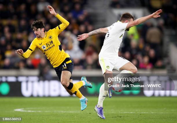 Francisco Trincao of Wolverhampton Wanderers is challenged by Stuart Dallas of Leeds United during the Premier League match between Wolverhampton...