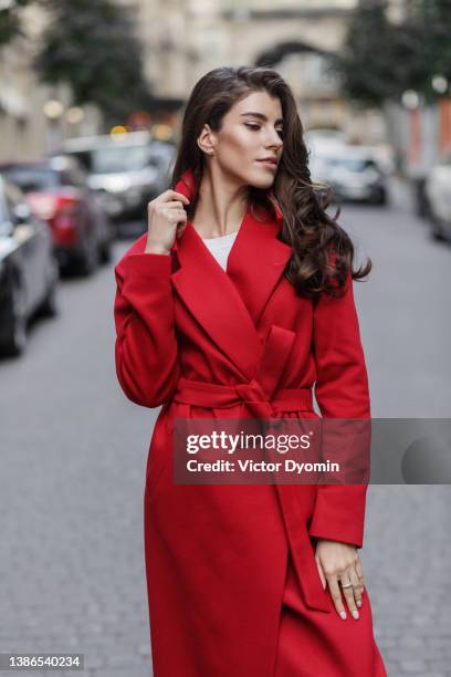 portrait of the smiling stylish young brunette - red belt stock pictures, royalty-free photos & images