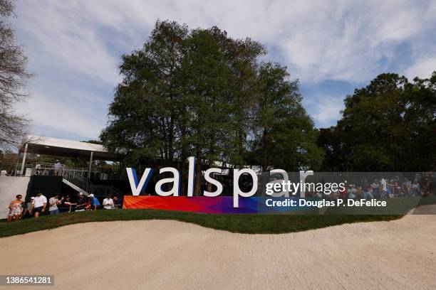 Signage is displayed next to the 13th green during the third round of the Valspar Championship on the Copperhead Course at Innisbrook Resort and Golf...