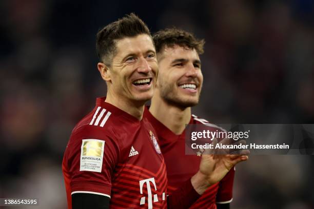 Robert Lewandowski of FC Bayern München celebartes with team amte Lucas Hernandez after winning the Bundesliga match between FC Bayern München and 1....