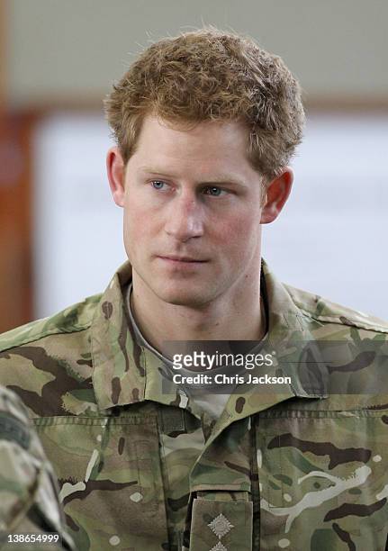 Prince Harry looks on during a visit to RAF Honington on February 10, 2012 in Honington, England. The Prince met Afghanistan veterans and was shown...