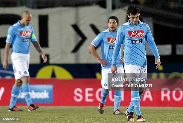 Napoli's Blerim Dzemalli of Switzerland reacts with teammates Walter Alejandro Gargano of Uruguay and Paolo Cannavaro at the end of their first leg...