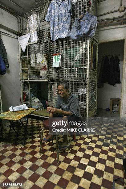 Hongkong-handover-10years-economy This picture taken 14 May, 2007 shows Kong Siu-kan resting outside his "cage dwelling", in one of the world's most...