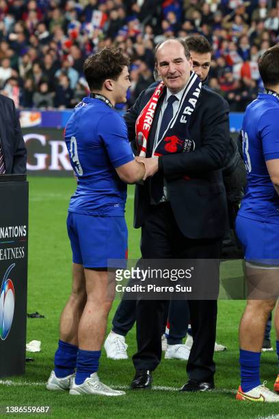 Prime Minister Jean Castex congratulates Antoine Dupont during the Guinness Six Nations Rugby match between France and England at Stade de France on...