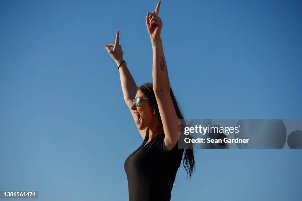 Fan cheers during the NASCAR Xfinity Series Nalley Cars 250 at Atlanta Motor Speedway on March 19, 2022 in Hampton, Georgia.