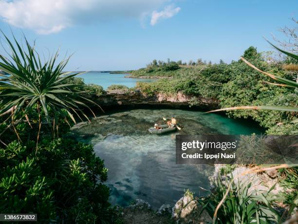 sea cave hole kayaking, miyako island, okinawa, japan - okinawa prefecture fotografías e imágenes de stock