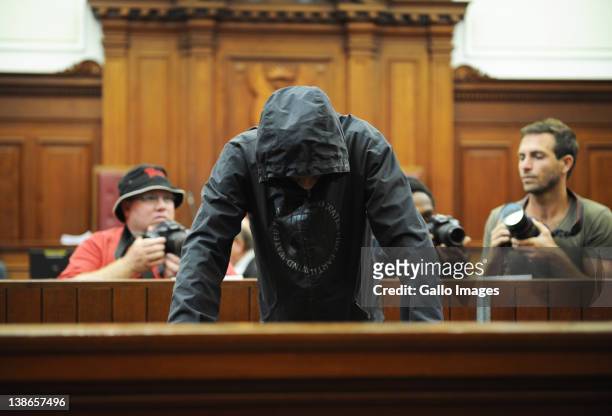 Xolile Mngeni appears in the Cape Town High Court, on February 10, 2012 in Cape Town, South Africa. He is accused of being involved in the murder on...