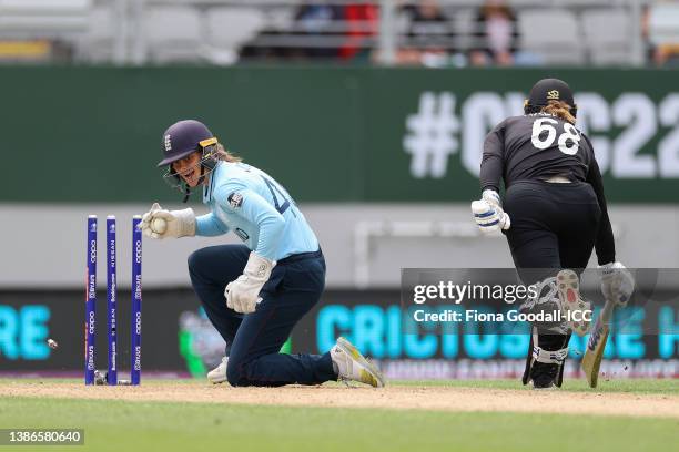 Amy Jones of England celebrates after taking the wicket of Brooke Halliday of New Zealand during the 2022 ICC Women's Cricket World Cup match between...