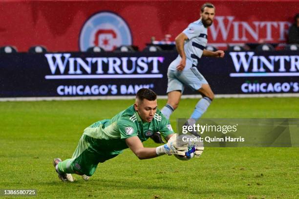 Gabriel Slonina of Chicago Fire makes a save in the second half against the Sporting Kansas City at Soldier Field on March 19, 2022 in Chicago,...