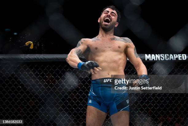 Makwan Amirkhani loses his gum shield as he celebrates beating Mike Grundy during UFC Fight Night: Volkov v Aspinall at the The O2 Arena on March 19,...