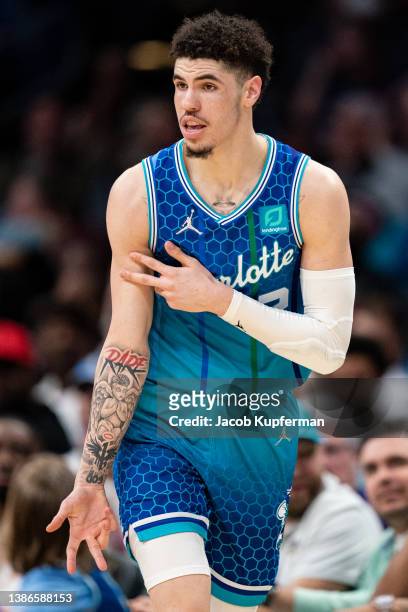 LaMelo Ball of the Charlotte Hornets reacts after making a 3-point shot in the fourth quarter during their game against the Dallas Mavericks at...