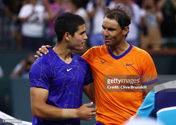 Rafael Nadal of Spain shakes hands at the net after his three set victory against Carlos Alcaraz of Spain in their semifinal match on Day 13 of the...