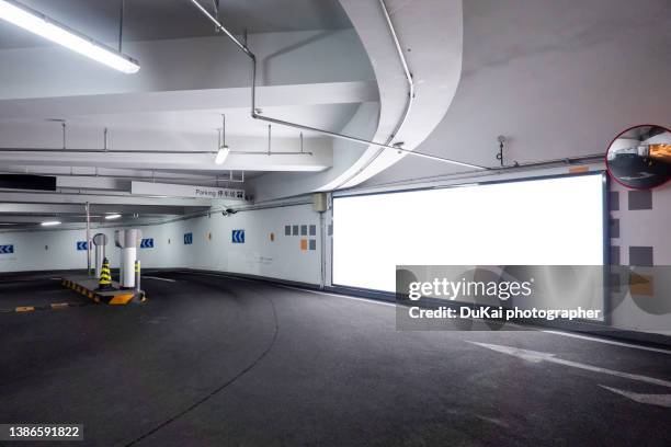 entrance of the underground garage - billboard highway stock-fotos und bilder