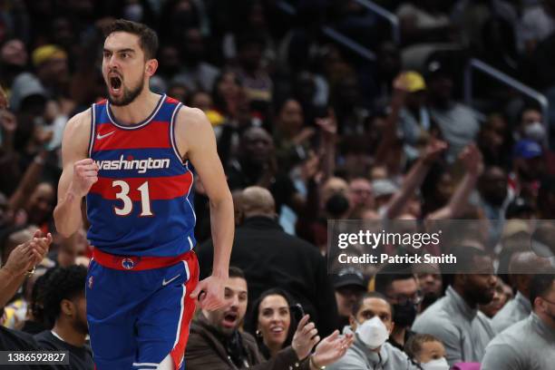 Tomas Satoransky of the Washington Wizards celebrates against the Los Angeles Lakers during the second half at Capital One Arena on March 19, 2022 in...