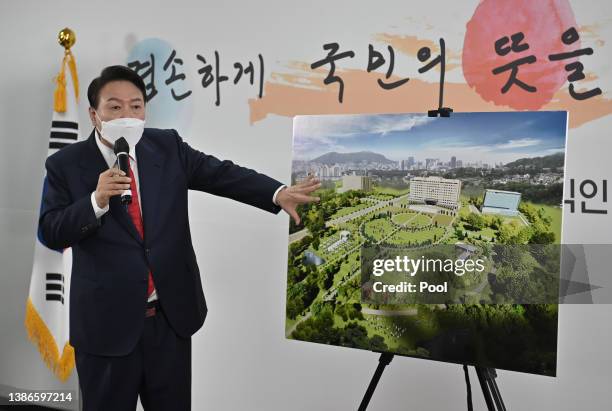 President-elect Yoon Suk-yeol shows a bird's eye view of his planned relocation of the presidential office during his press conference on March 20,...