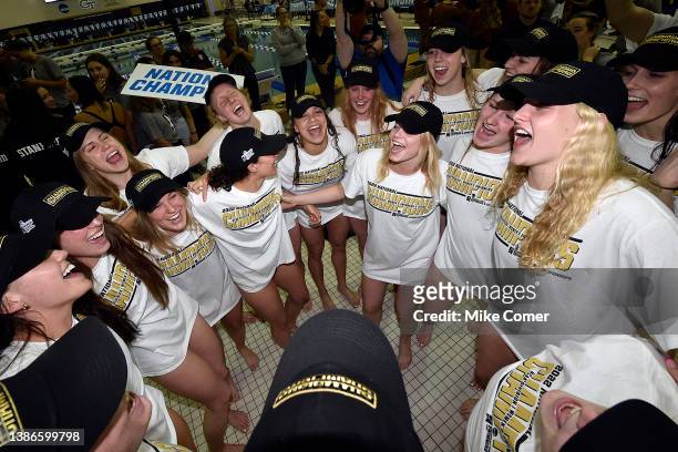 The University of Virginia Cavaliers celebrate after winning the Division I Women’s Swimming & Diving Championships held at the McAuley Aquatic...