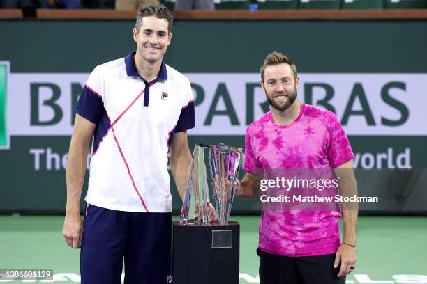 John Isner and Jack Sock pose for photographers after defeating Santiago Gonzalez of Mexico and Edaouard Roger-Vasselin of France during the men's...