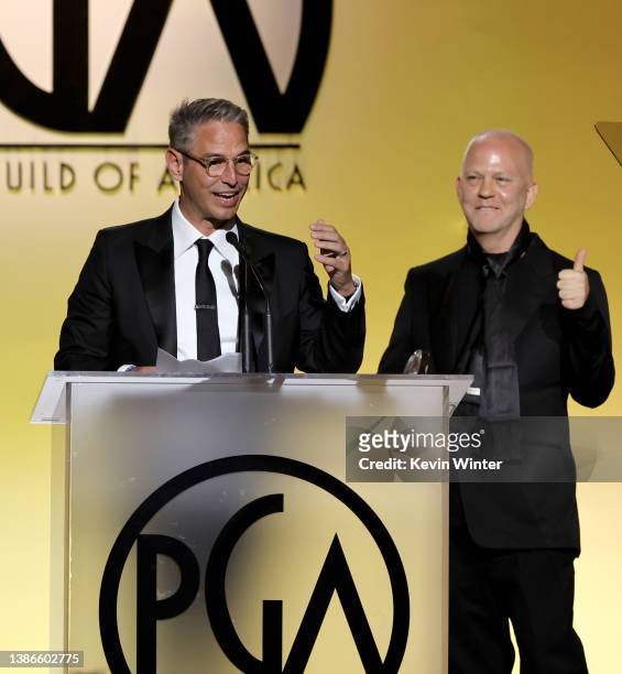 Greg Berlanti accepts the Norman Lear Achievement Award In Television from Ryan Murphy onstage during the 33rd Annual Producers Guild Awards at...