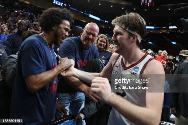 Drew Timme of the Gonzaga Bulldogs celebrates with fans after defeating the Memphis Tigers 82-78 during the second half in the second round of the...
