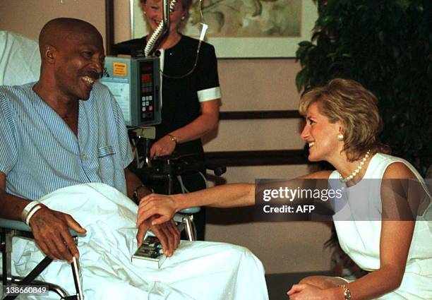 Princess Diana meets with John Collins, a 51-year-old lung cancer patient while touring Northwestern Memorial Hospital's Hospice- Palliative Care...