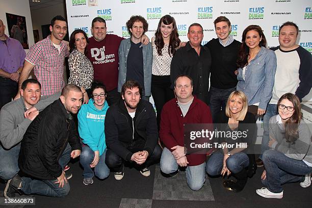 The cast and crew of "Elvis Duran and the Morning Show" pose with Karmin before their Saturday Night Live performance at Z100 Studios on February 10,...