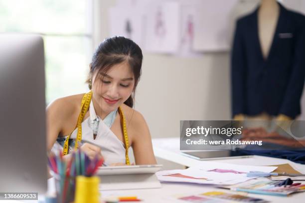 fashion designer creates sketches clothes using computer-aided design - computer aided design stockfoto's en -beelden