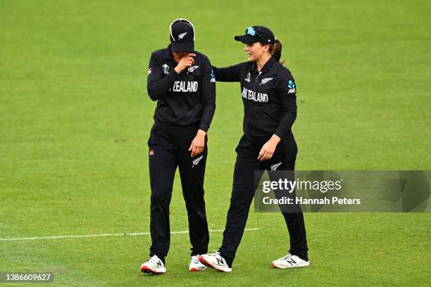 Suzie Bates and Amelia Kerr of New Zealand leave the field after losing the 2022 ICC Women's Cricket World Cup match between New Zealand and England...