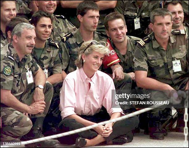 Photo dated 10 August 1997 shows Diana, Princess of Wales, posing for a photograph with some French SFOR soldiers at Sarajevo airport before her...