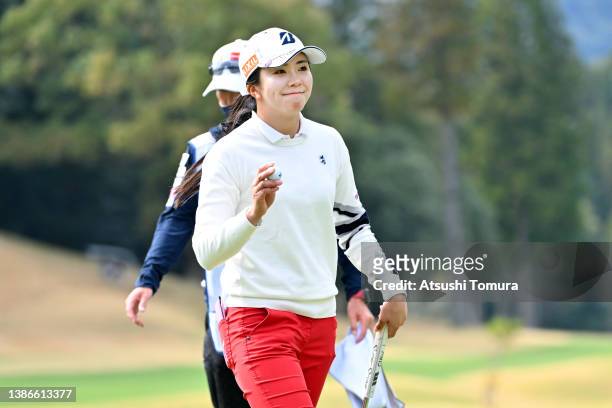 Kotone Hori of Japan acknowledges the gallery after the birdie on the 16th green during the final round of T-POINT x ENEOS Golf Tournament at...