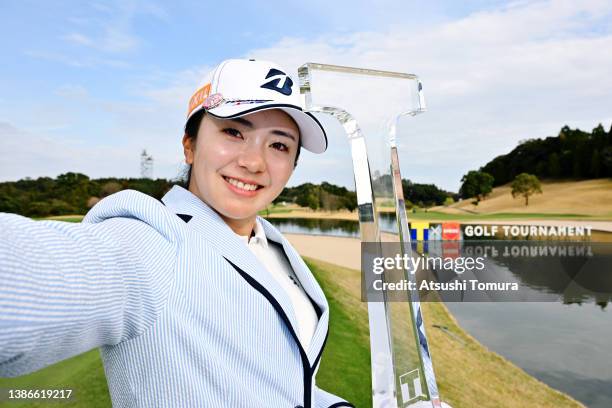 Kotone Hori of Japan imitates the selfie after winning the tournament following the final round of T-POINT x ENEOS Golf Tournament at Kagoshima...