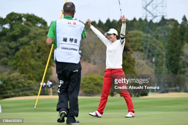 Kotone Hori of Japan celebrates winning the tournament on the 18th green during the final round of T-POINT x ENEOS Golf Tournament at Kagoshima...